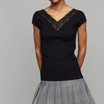 Black ribbed knit top with delicate lace V-neck trim and short sleeves, paired with plaid skirt — Maje | Endless UAE