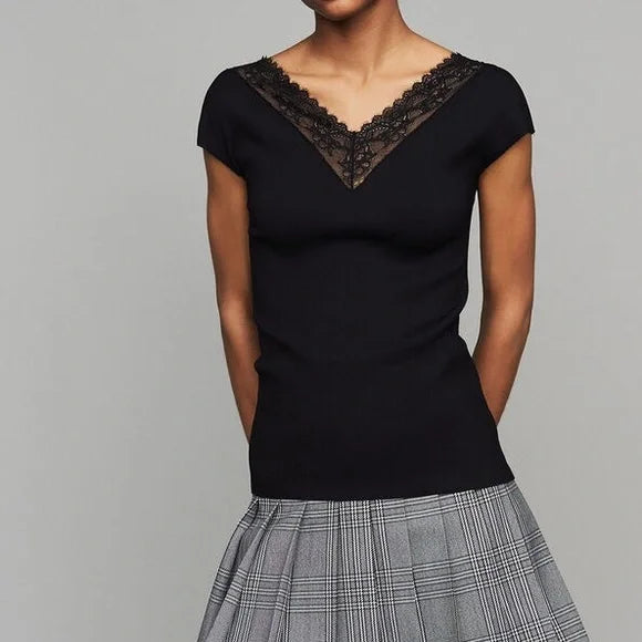 Black ribbed knit top with delicate lace V-neck trim and short sleeves, paired with plaid skirt — Maje | Endless UAE
