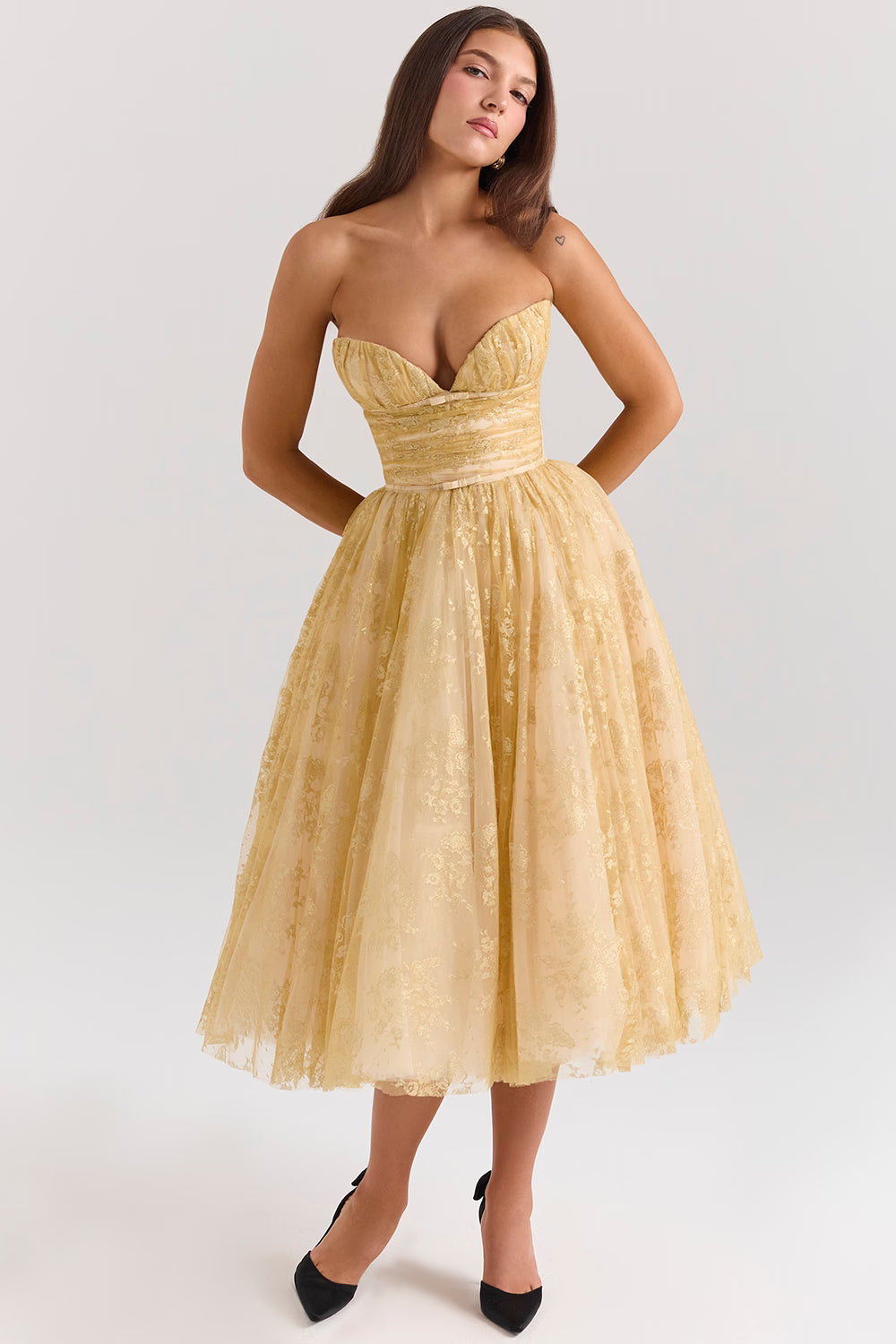 Woman wearing gold metallic lace tulle strapless midi gown with ruched waist — House of CB | Endless UAE