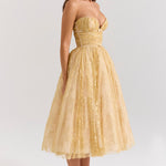 Woman wearing gold metallic lace tulle strapless midi gown with ruched waist — House of CB | Endless UAE