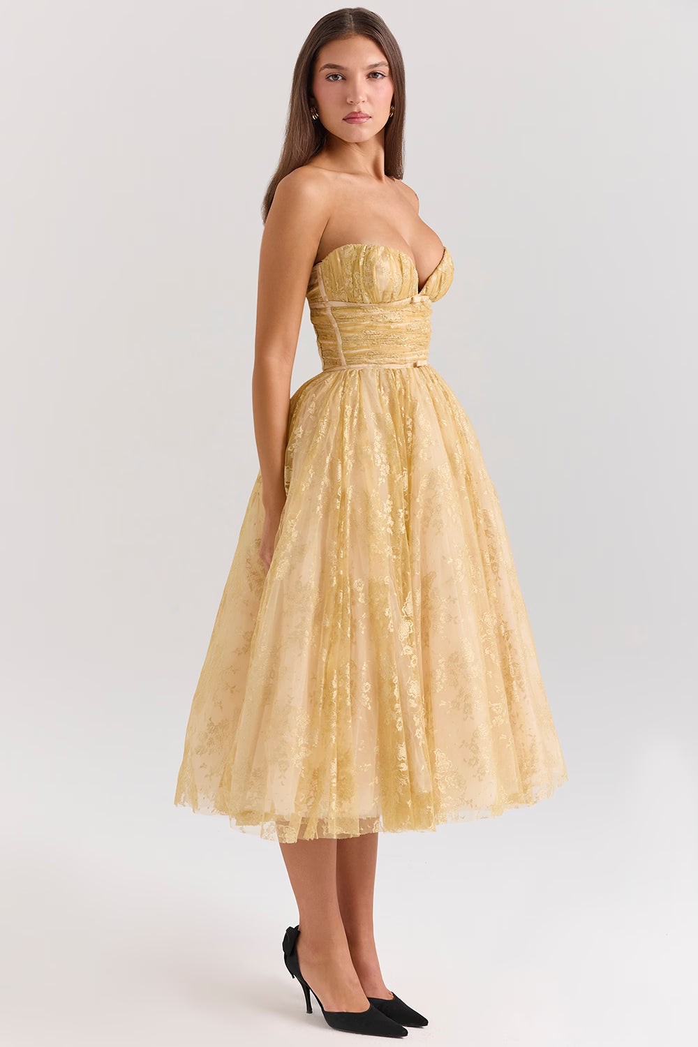 Woman wearing gold metallic lace tulle strapless midi gown with ruched waist — House of CB | Endless UAE
