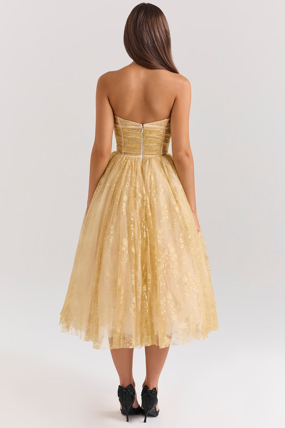 Woman wearing gold metallic lace tulle strapless midi gown with ruched waist — House of CB | Endless UAE