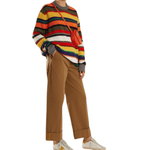 Wide-leg camel brown chinos with cuffed hems styled with colorful striped sweater and sneakers — Acne Studios | Endless UAE