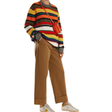 Wide-leg camel brown chinos with cuffed hems styled with colorful striped sweater and sneakers — Acne Studios | Endless UAE