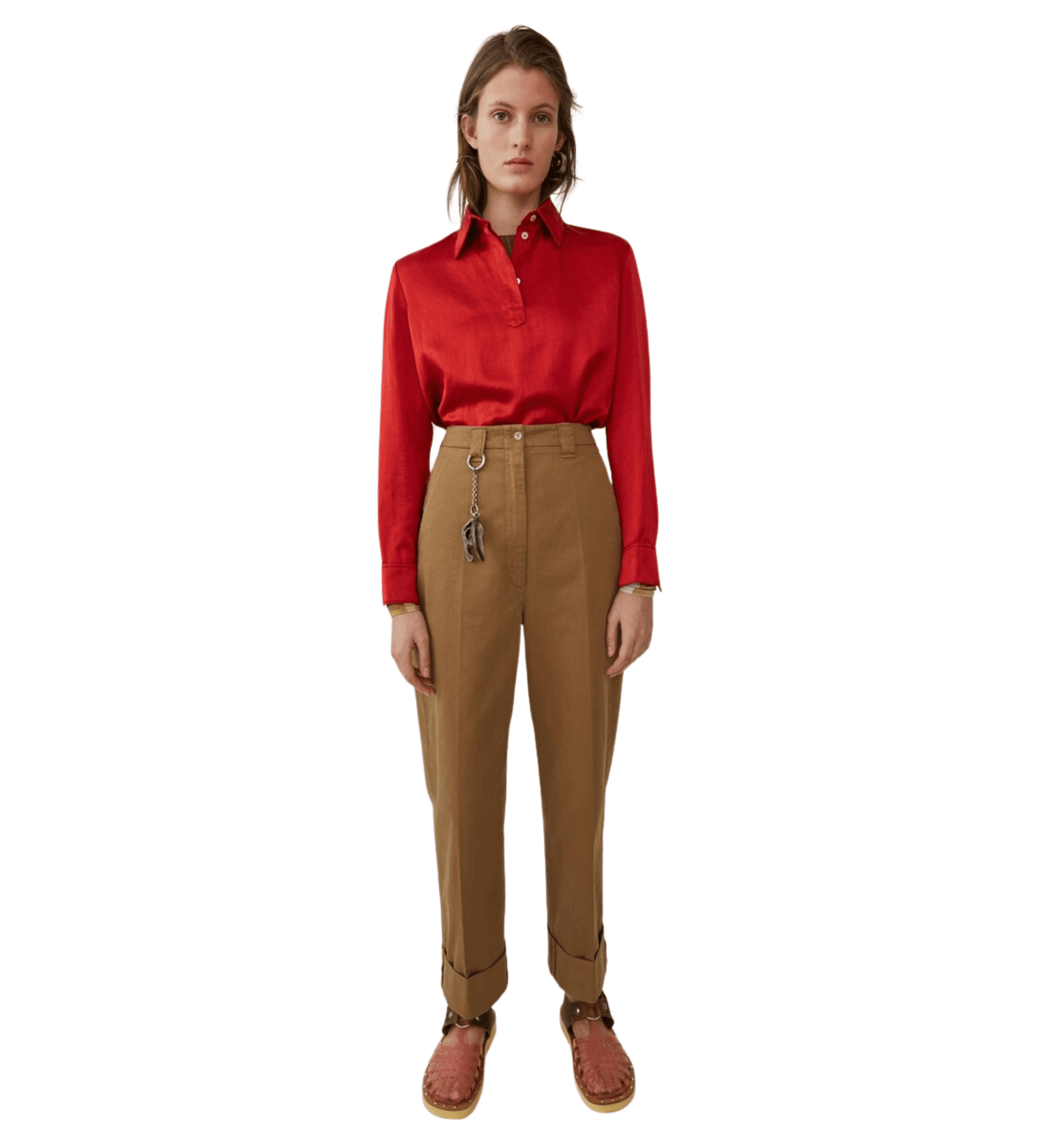 Woman wearing tan Madya Co chinos with cuffed hems and red polo shirt, styled with leather sandals — Acne Studios | Endless UAE
