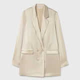 Woman wearing a relaxed hazelnut blazer and matching trousers with a red pendant necklace — Silk Laundry | Endless UAE