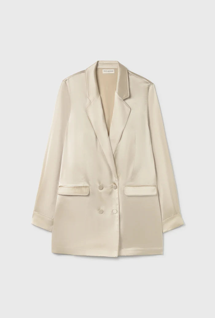 Woman wearing a relaxed hazelnut blazer and matching trousers with a red pendant necklace — Silk Laundry | Endless UAE