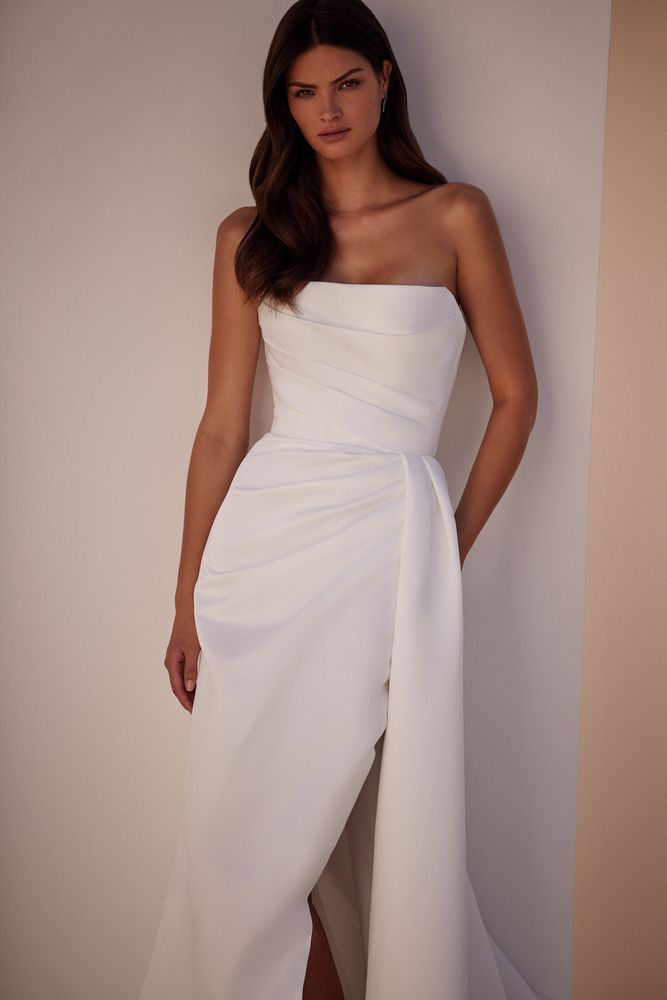 Elegant white strapless bridal gown with draped bodice and high slit skirt — Milla Nova | Endless UAE