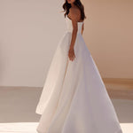 Elegant strapless white A-line wedding gown with structured bodice and flowing skirt train — Milla Nova | Endless UAE