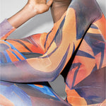 Woman in abstract print maxi dress with orange and blue brushstroke pattern — Louisa Ballou | Endless UAE