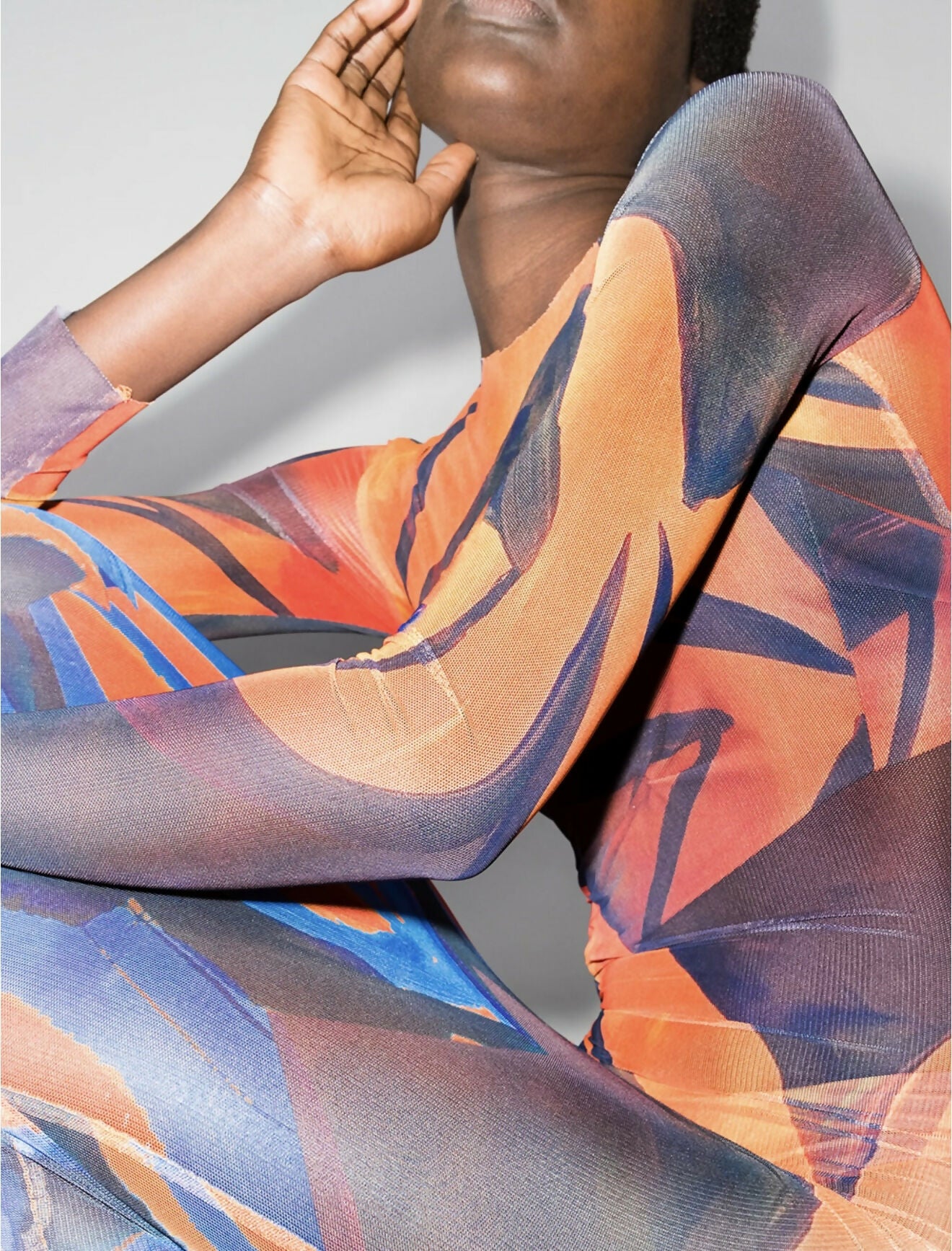 Woman in abstract print maxi dress with orange and blue brushstroke pattern — Louisa Ballou | Endless UAE