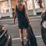 Black sequin sleeveless mini dress with scoop back, styled with ankle boots and blazer — Mikuta | Endless UAE