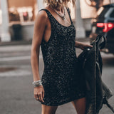 Black sequin embellished sleeveless mini tank dress worn with silver bracelets and black leather jacket — Mikuta | Endless UAE