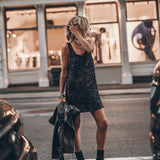 Black sequin sleeveless mini dress with scoop back, styled with combat boots and leather jacket — Mikuta | Endless UAE