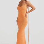 Woman wearing peach ribbed sleeveless maxi gown with cowl neckline — Melani The Label | Endless UAE