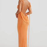 Woman wearing peach ribbed sleeveless maxi gown with cowl neckline — Melani The Label | Endless UAE