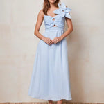 Woman wearing light blue linen midi dress with cut-out detail and bow shoulder — Mint Velvet | Endless UAE