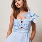 Woman wearing light blue linen midi dress with cut-out detail and bow shoulder — Mint Velvet | Endless UAE