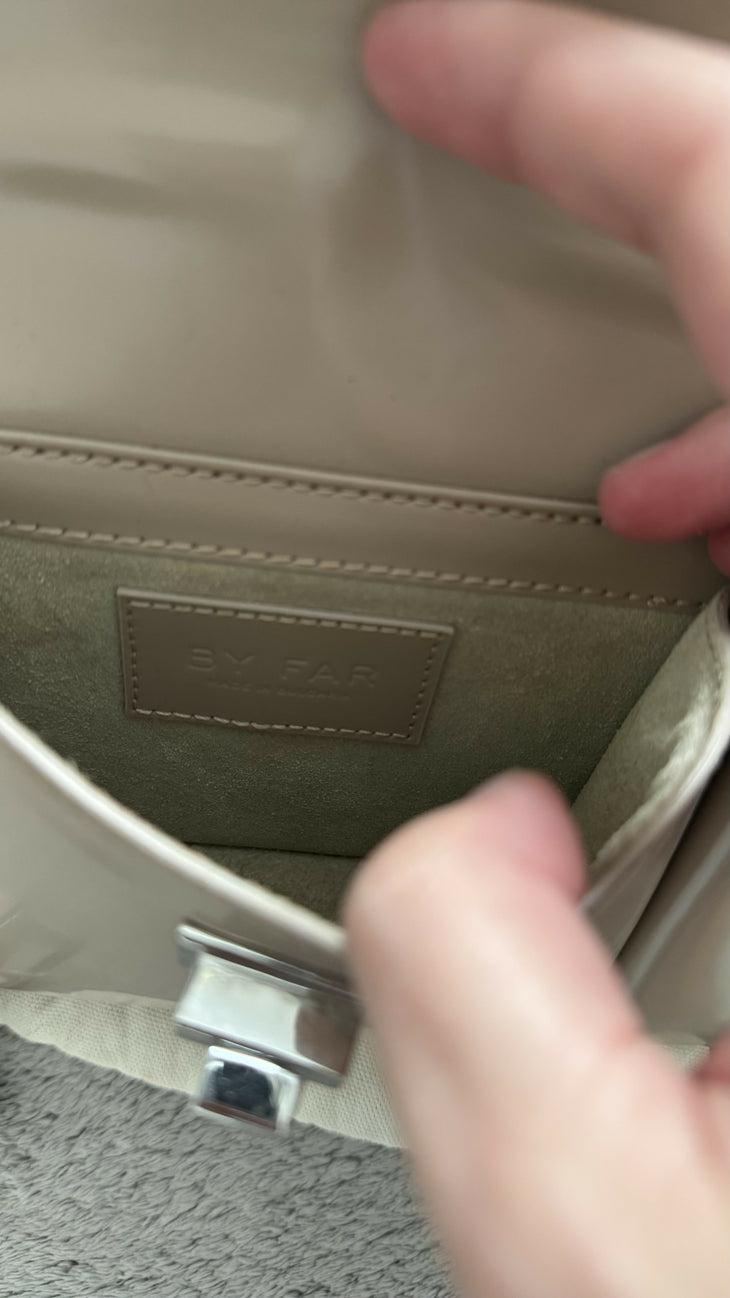 Beige patent leather shoulder bag with dual compartments and silver turnlock closures — Endless | Endless UAE