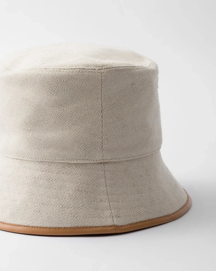 Cream linen blend bucket hat with tan leather trim and Prada logo — Prada | Endless UAE