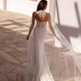 Elegant fitted wedding gown with sheer embellished cape and illusion back detail in ivory — You&I Bridal | Endless UAE