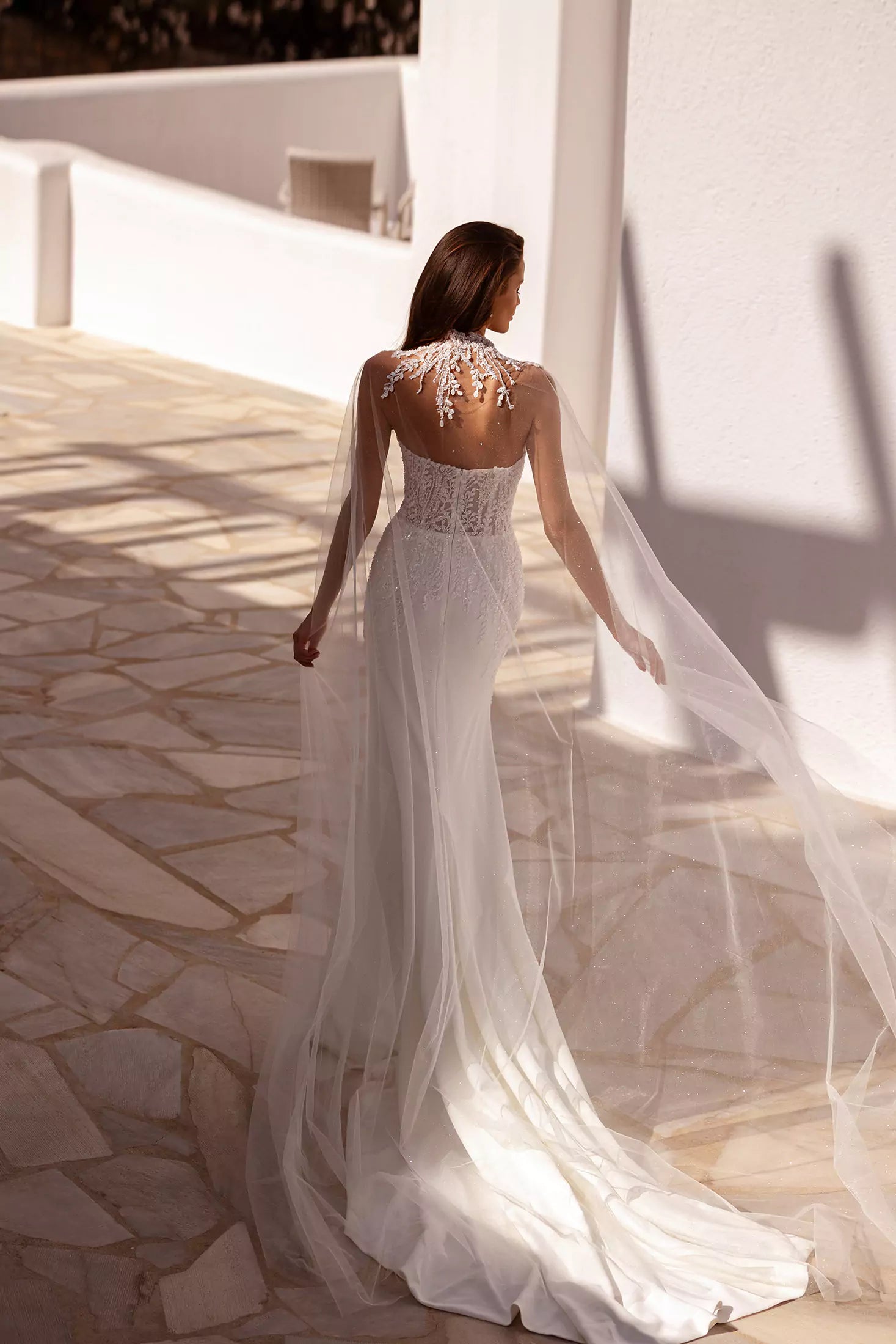 Elegant fitted wedding gown with sheer embellished cape and illusion back detail in ivory — You&I Bridal | Endless UAE
