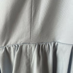 Woman wearing light blue sleeveless midi dress with corset top and full skirt — Endless | Endless UAE