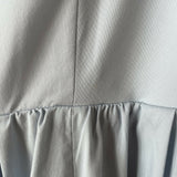 Woman wearing light blue sleeveless midi dress with corset top and full skirt — Endless | Endless UAE