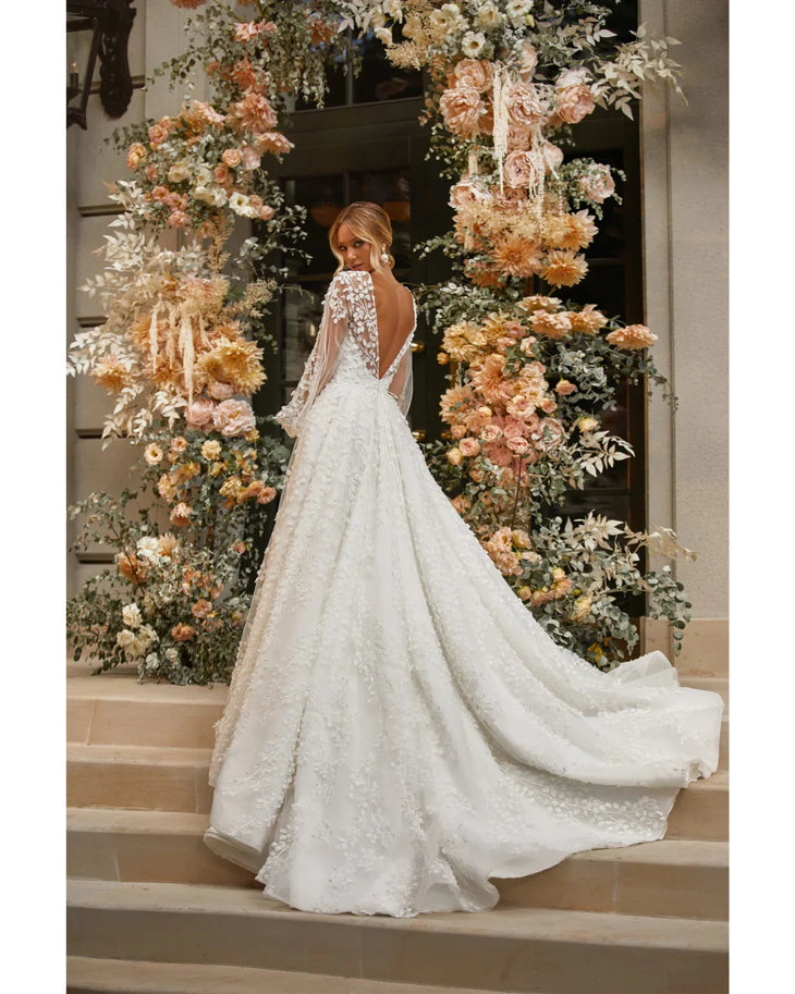 Marcy white lace wedding dress with sheer floral sleeves and plunging neckline — Katy Corso | Endless UAE