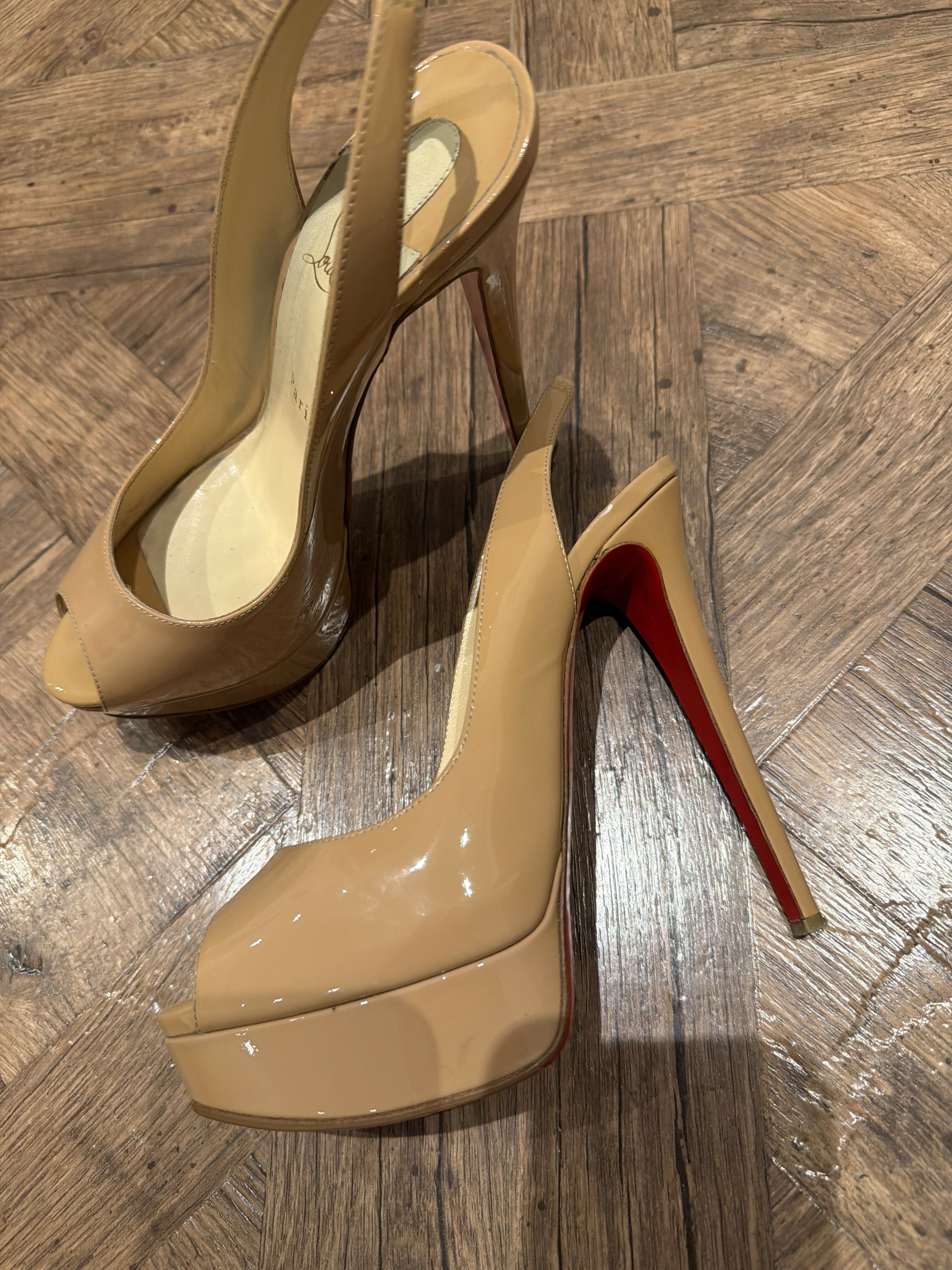 Nude patent leather peep-toe sling-back pumps with red sole — Christian Louboutin | Endless UAE
