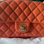 Coral quilted lambskin mini classic handbag with gold CC logo — Chanel | Endless UAE
