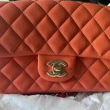Coral quilted lambskin mini classic handbag with gold CC logo — Chanel | Endless UAE