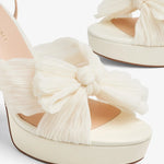 Cream platform heels with pleated bow detail and ankle strap — Loeffler Randall | Endless UAE