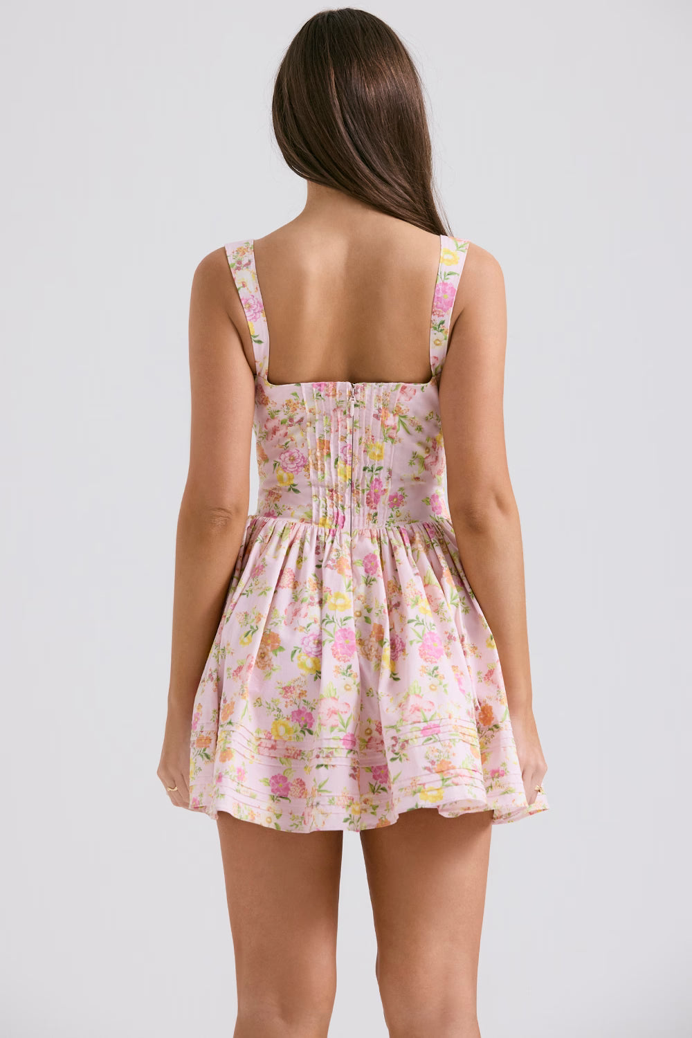 Rear view of pink floral print mini dress with fitted bodice, flared skirt, and square back neckline — House of CB | Endless UAE