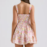 Rear view of pink floral print mini dress with fitted bodice, flared skirt, and square back neckline — House of CB | Endless UAE