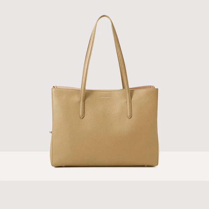Beige leather tote bag with dual handles and minimalist design — Coccinelle | Endless UAE