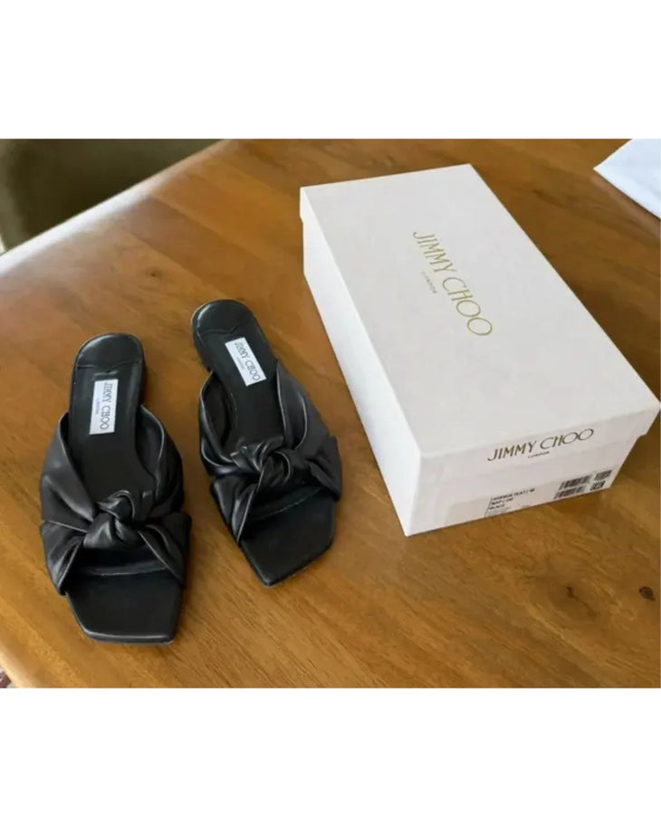 Black leather flat sandals with bow detail — Jimmy Choo | Endless UAE