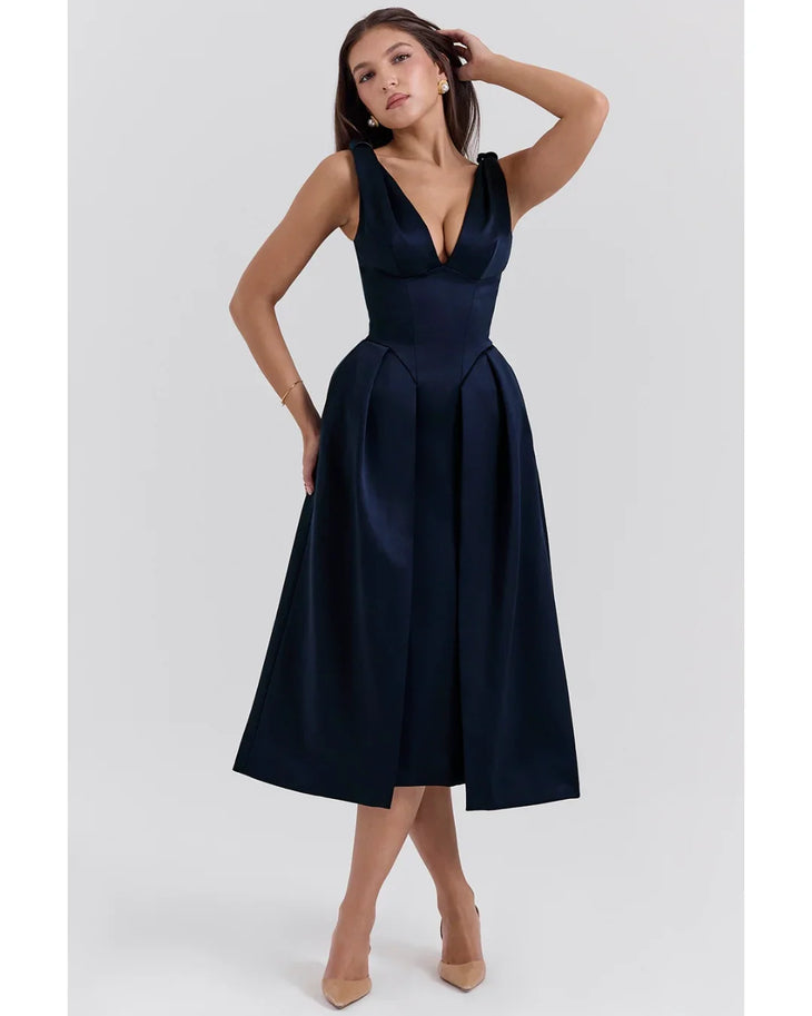 Woman wearing navy blue satin midi dress with twisted shoulder straps and full skirt — House of CB | Endless UAE