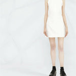 White sleeveless mini dress with square neckline and cut-out back detail, styled with platform boots — Courrèges | Endless UAE