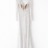 Elegant white lace wedding dress with long sleeves and flowing tulle train — Tatiana Kaplun | Endless UAE