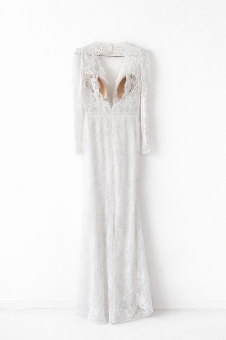 Elegant white lace wedding dress with long sleeves and flowing tulle train — Tatiana Kaplun | Endless UAE