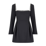 Black mini dress with pearl-trimmed square neckline and long sleeves — Odd Muse | Endless UAE