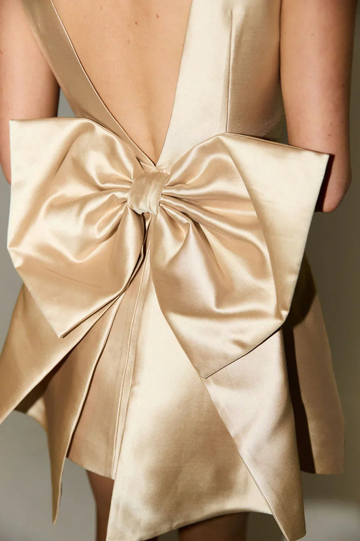 Gold bow detail mini dress on model — Odd Muse | Endless UAE