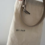 Beige patent leather shoulder bag with dual compartments and silver turnlock closures — Endless | Endless UAE
