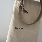 Beige patent leather shoulder bag with dual compartments and silver turnlock closures — Endless | Endless UAE