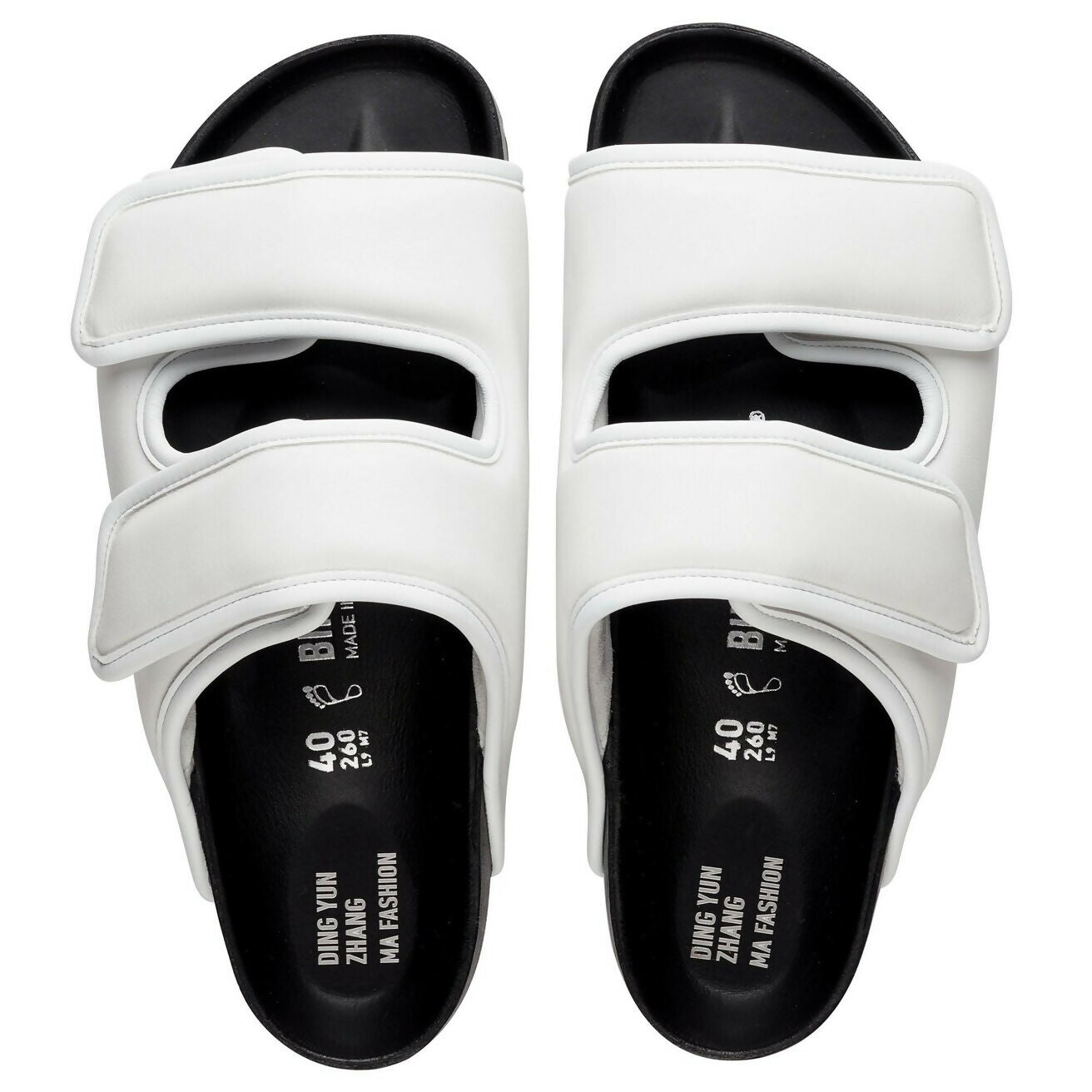 White leather double-strap sandals with black footbed and cushioned upper straps by Dingyun Zhang — 1774 Birkenstock | Endless UAE