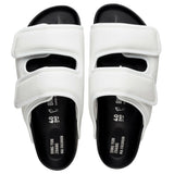 White leather double-strap sandals with black footbed and cushioned upper straps by Dingyun Zhang — 1774 Birkenstock | Endless UAE