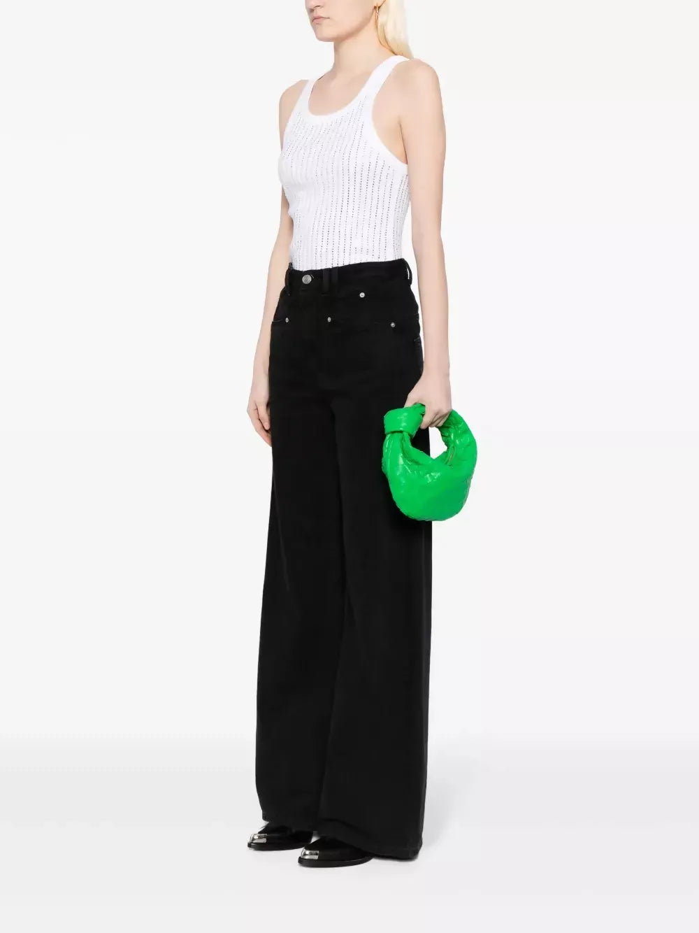 Bright green leather hobo bag held by model in white ribbed tank and black wide-leg pants — Bottega Veneta | Endless UAE