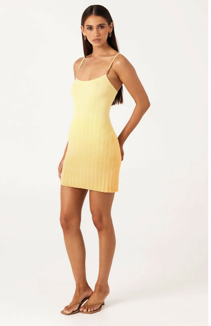 Light yellow ribbed knit mini dress with thin straps and form-fitting silhouette on model — SNDYS | Endless UAE