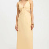 Yellow halter neck maxi dress with cutout ring detail at bust and mesh panel, styled with gold bracelet — Kookai | Endless UAE
